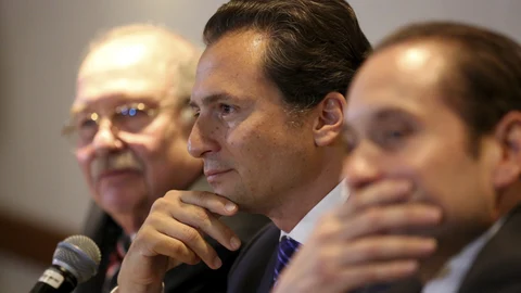 FILE - In this Aug. 17, 2017 file photo, flanked by his lawyers, Emilio Lozoya, former head of Mexico's state-owned oil company Pemex, attends a press conference in Mexico City. The alleged examples of kickbacks, bribes and graft contained in accusations by Lozoya on Wednesday, Aug. 20, 2020, include that one government contractor gave then-President Enrique Pena Nieto a Ferrari sports car. (AP Photo/Gustavo Martinez Contreras, File)