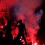 Paris St Germain fans watch the final, as play resumes behind closed doors following the outbreak of the coronavirus disease (COVID-19)