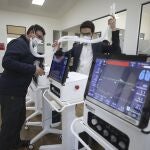 Engineers from La Sabana University demonstrate low-cost ventilators for patients with COVID-19 in Bogota, Colombia, Monday, July 6, 2020. The machine called the Heron looks like many other ventilators used to treat COVID-19 patients, but this device costs about $4,000, a fifth of the price of ventilators imported from China, and it's made in Colombia, where some hospitals have been overwhelmed by coronavirus patients. (AP Photo/Fernando Vergara)