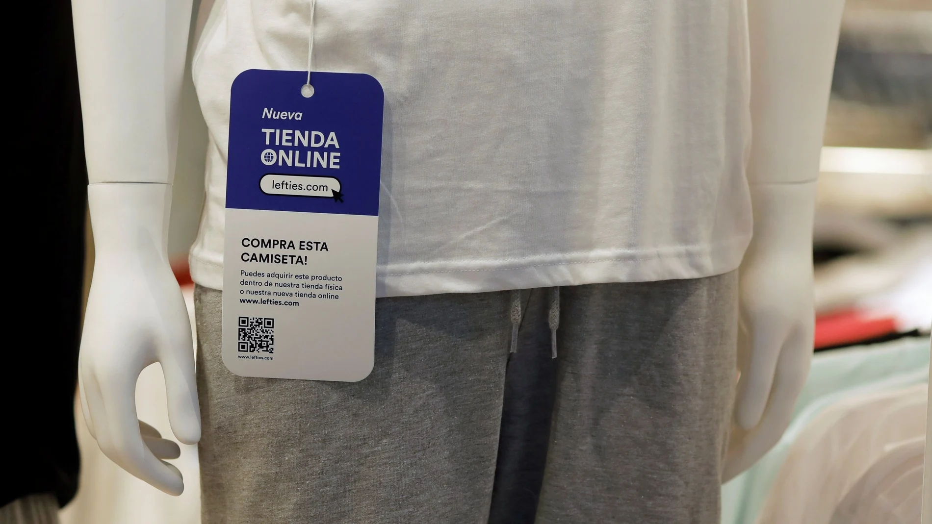 A tag promoting the new Lefties online shop is seen on a mannequin at a Lefties store, an Inditex brand, in Malaga