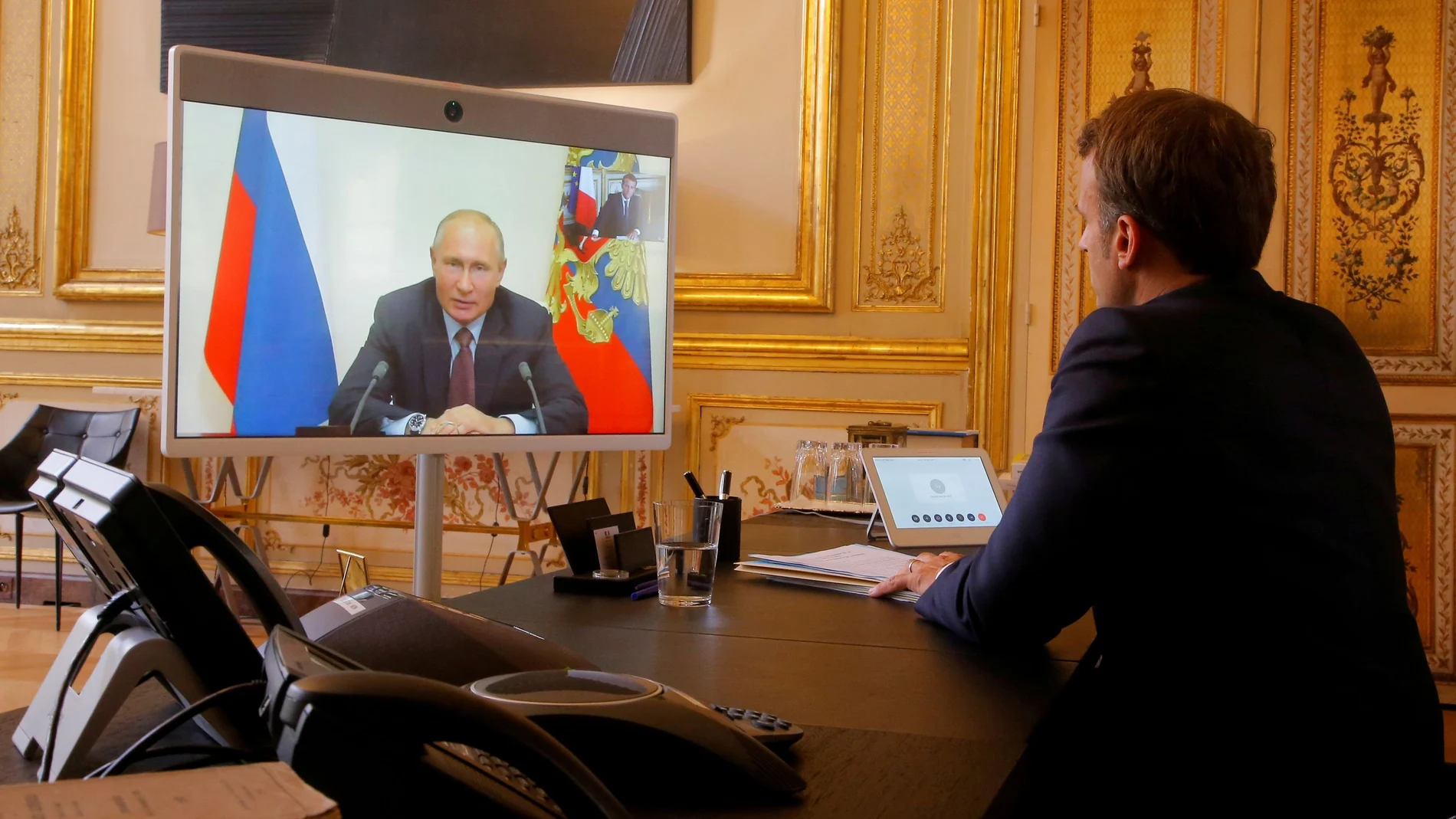 FILE PHOTO: French President Emmanuel Macron holds a video meeting with Russian President Vladimir Putin