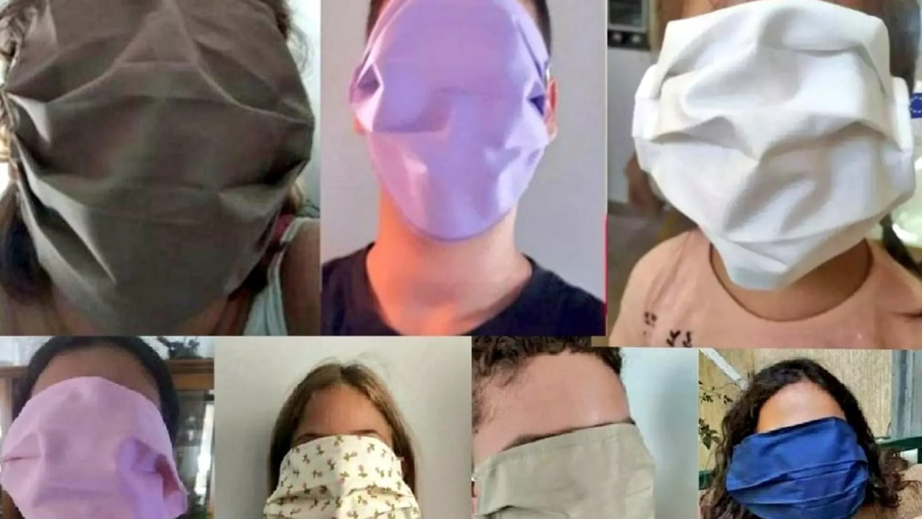 Varios alumnos de un colegio en Grencia con enormes mascarillas que les cubren toda la cara