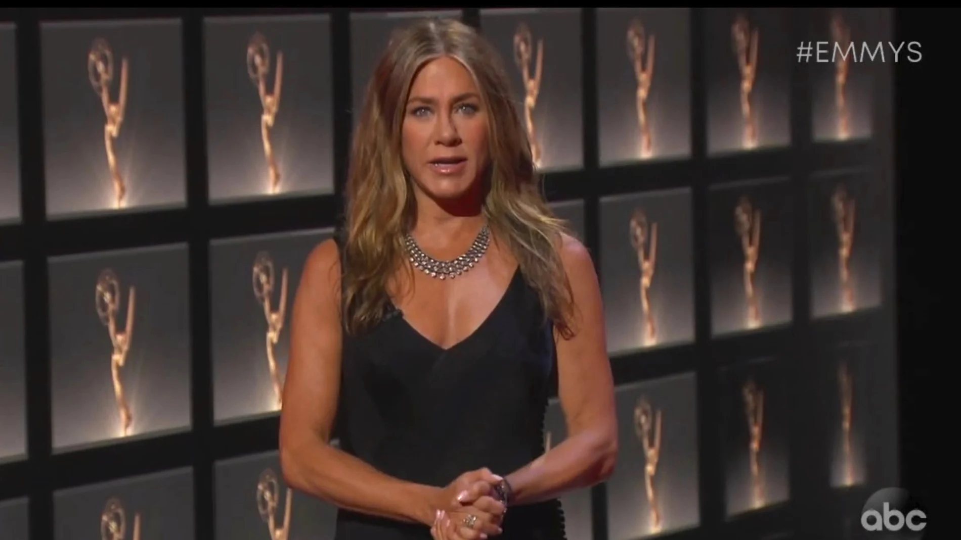 In this video grab captured on Sept. 20, 2020, courtesy of the Academy of Television Arts & Sciences and ABC Entertainment, Jennifer Aniston presents the award for outstanding lead actress in a comedy series during the 72nd Emmy Awards broadcast. (The Television Academy and ABC Entertainment via AP)