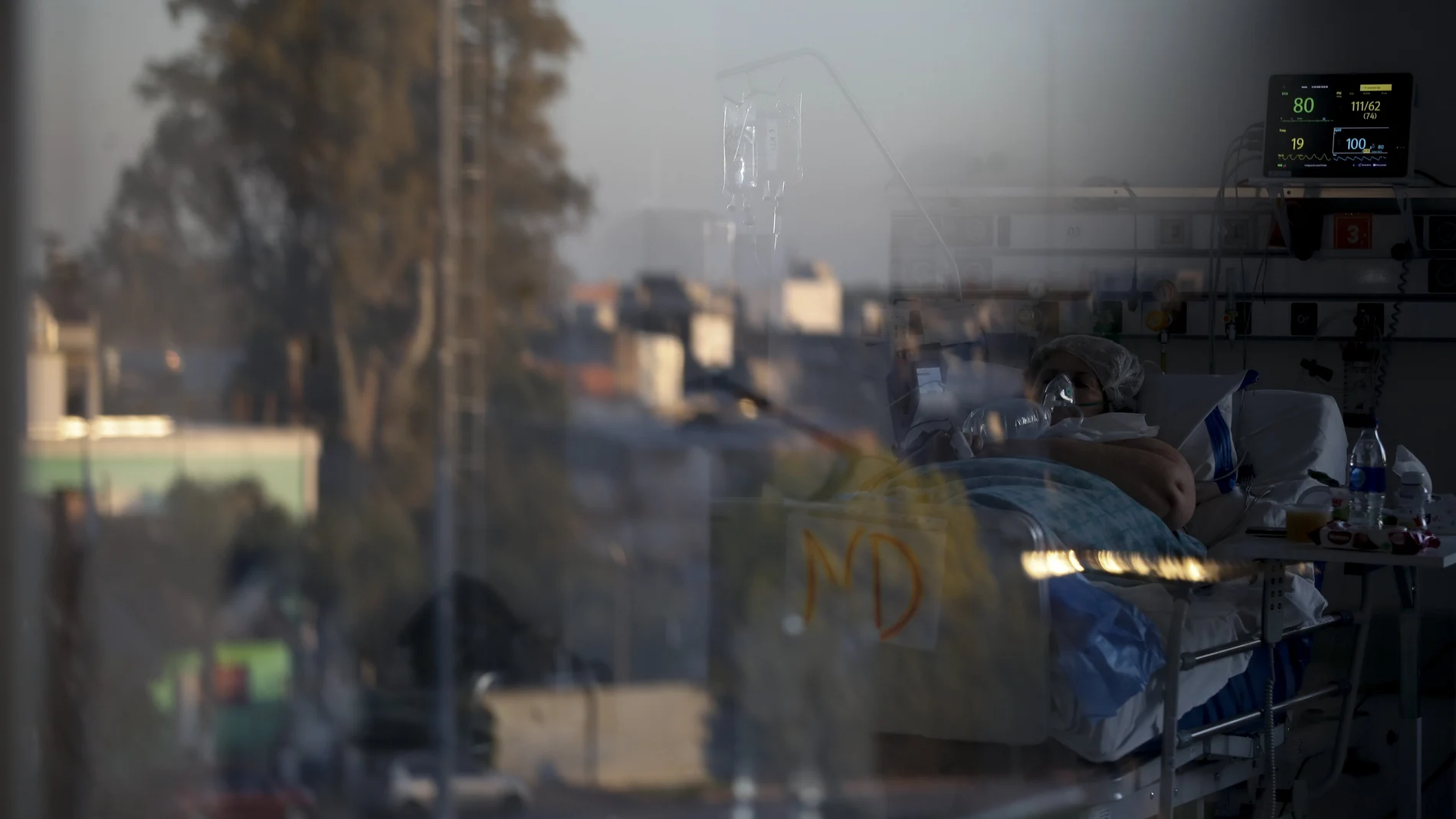 A patient infected with COVID-19 lies on a bed at a hospital in Buenos Aires, Argentina, Monday, Sept. 21, 2020. (AP Photo/Natacha Pisarenko)
