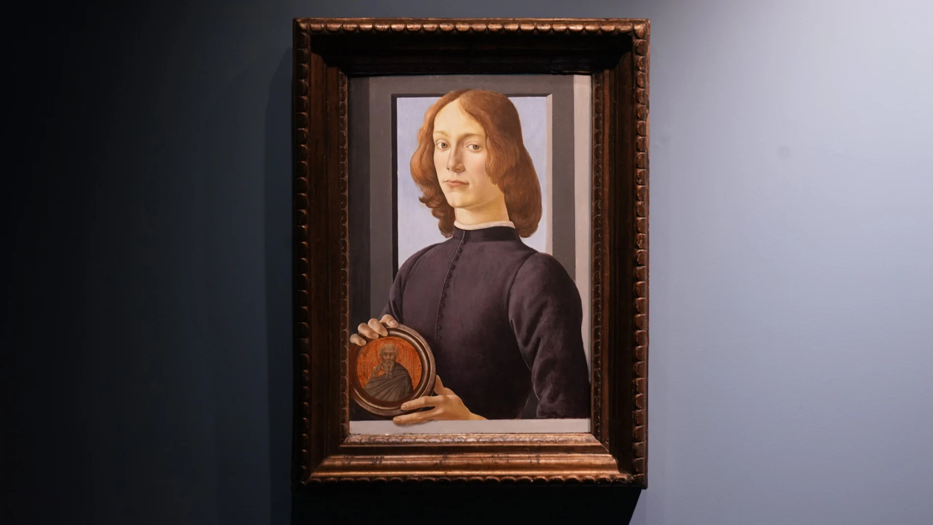 Sandro Botticelli's 15th-century painting called "Young Man Holding a Roundel" is displayed at Sotheby's on Sept. 23, 2020, in New York. The painting will go on auction next year and art watchers will be seeing if it fetches more than its eye-watering $80 million estimate, despite the pandemic. Botticelliâ€™s 15th-century portrait of a nobleman in â€œYoung Man Holding a Roundelâ€ is the highlight of Sothebyâ€™s Masters Week sale series in New York in January. (AP Photo/Seth Wenig)