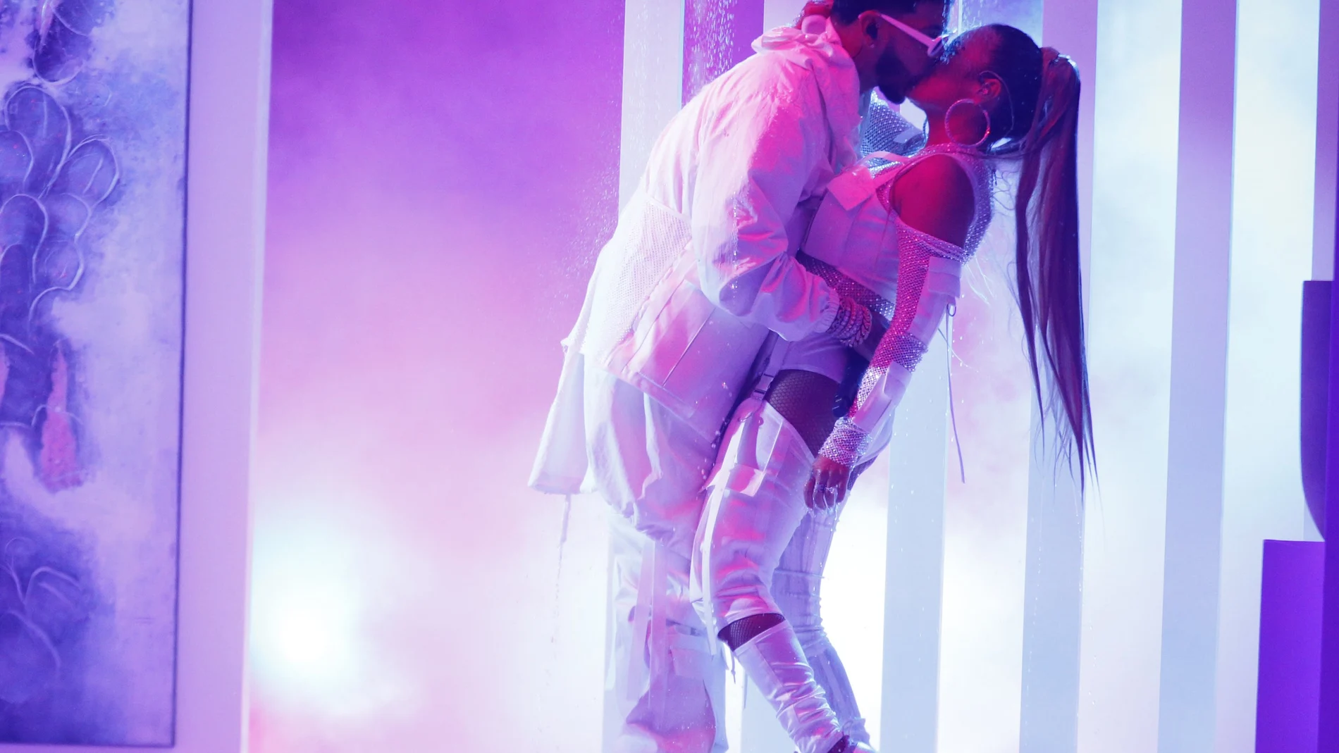 FILE - Anuel AA, left, kisses Karol G as they perform a medley at the Billboard Latin Music Awards in Las Vegas on April 25, 2019. Karol G. has four Latin Grammy nominations, including two shared with Nicki Minaj. Karol Gâ€™s fiancÃ©, Puerto Rican rapper-singer Anuel AA, marked a major breakthrough this year as a first-time nominee. He scored seven nominations, including a bid for best new artist. (Photo by Eric Jamison/Invision/AP, File)