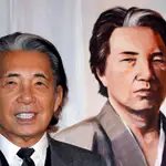 FILE PHOTO: Japanese fashion designer Kenzo Takada poses next to a painting of his self-portrait offered to Monaco's Princess Stephanie's "Fight Aids" foundation gala auction on World AIDS Day in Monaco December 1, 2014. REUTERS/Eric Gaillard/File Photo