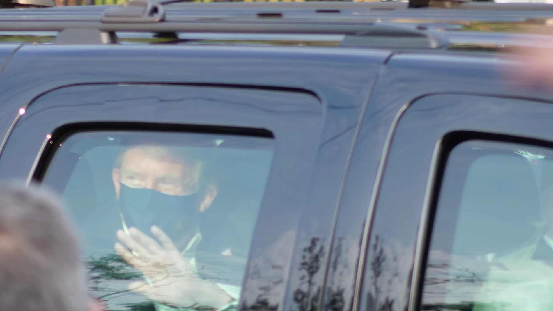 President Donald Trump drives past supporters gathered outside Walter Reed National Military Medical Center in Bethesda, Md., Sunday, Oct. 4, 2020. Trump was admitted to the hospital after contracting COVID-19. (AP Photo/