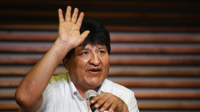 Former Bolivian President Evo Morales waves during a press conference in Buenos Aires, Argentina, one day after general elections in his home country, Monday, Oct. 19, 2020. Moralesâ€™ party claimed victory in a presidential election that appeared to reject the right-wing policies of the interim government that took power in Bolivia after the leftist leader resigned and fled the country a year ago. (AP Photo/Natacha Pisarenko)
