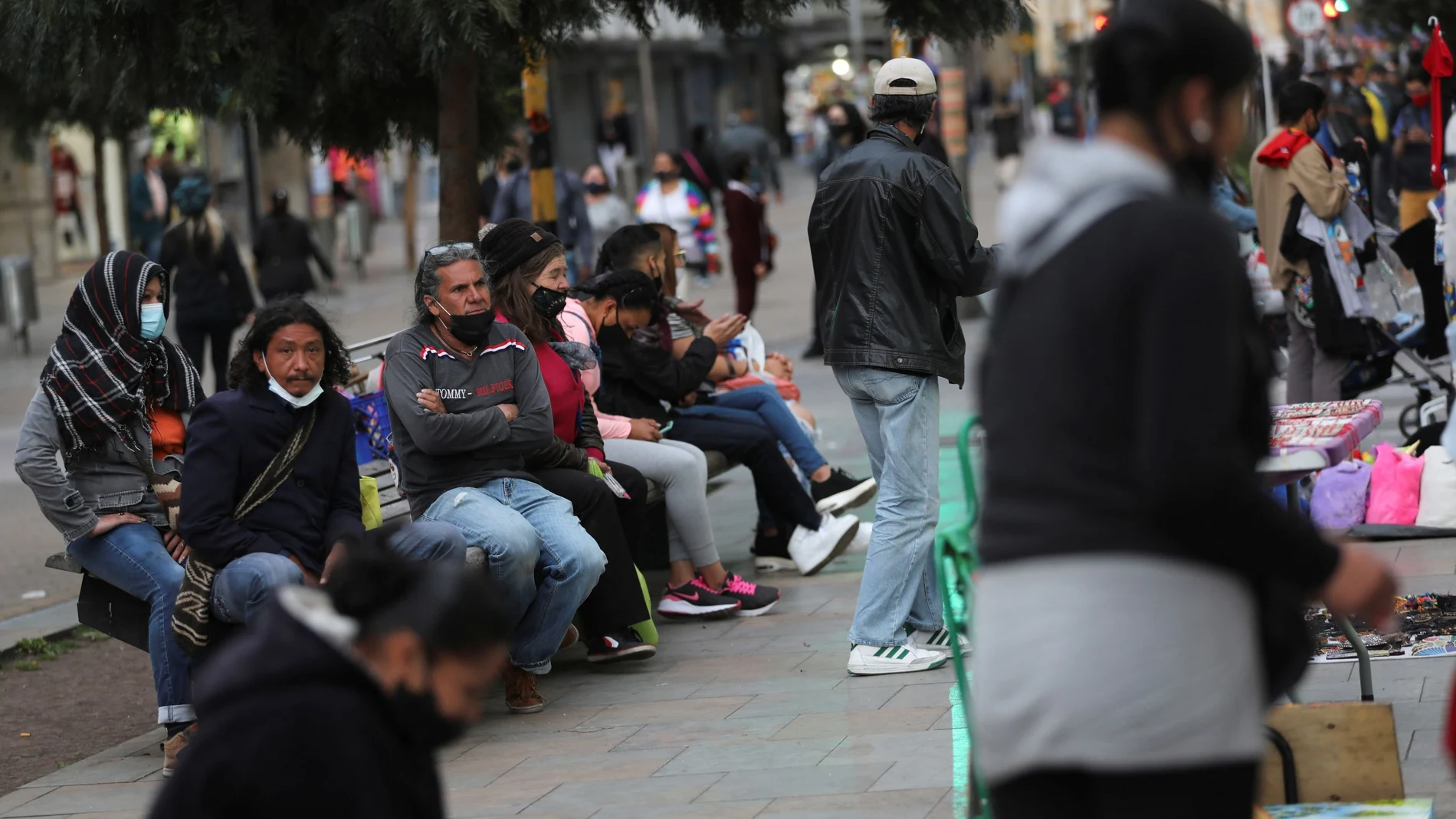 People sit in public spaces without keeping social distance, amidst the coronavirus disease (COVID-19) outbreak, in Bogota, Colombia October 23, 2020. Picture taken October 23, 2020. REUTERS/Luisa Gonzalez