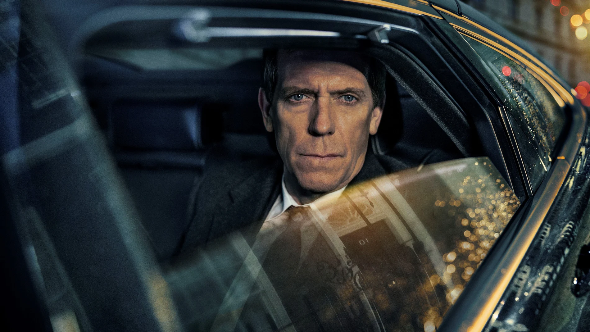 This image released by PBS shows Hugh Laurie as a heedless British politician beset by scandal in the four-episode series "Roadkill," premiering on MASTERPIECE, Sunday, Nov. 1, 2020 on PBS. (MASTERPIECE/PBS via AP)