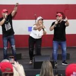 FILE- In this Tuesday, Oct. 27, 2020 file photo, members of the Cuban musical group Los 3 de La Habana, German Pinelli, left, Ana Paez, center, and Tirso Luis, right, sing during a "Make America Great Again!" event with Ivanka Trump at Bayfront Park Amphitheater, in Miami. Florida's Cuban American voters remain a bright spot in Trump's effort to retain his winning coalition from 2016. Polls show his strong support from these key voters may even be growing to include the younger Cuban Americans that Democrats once considered their best hope of breaking the GOP's hold. The musicians say Trumpâ€™s economic and foreign policies have been his main achievements. (AP Photo/Wilfredo Lee, File)