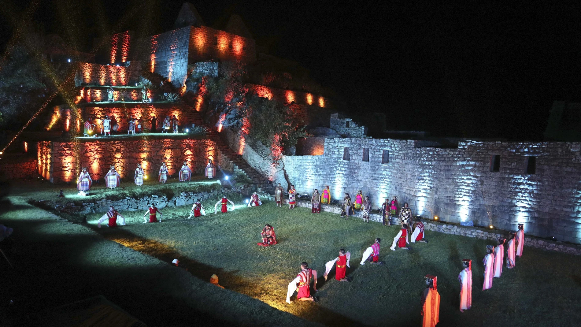 Artist Perform during a ceremony for the world-renowned Incan citadel of Machu Picchu as it reopens for the first time since its 8-months-long closure to help curb the spread of COVID-19, in the department of Cusco, Peru, Sunday, Nov. 1, 2020. (AP Photo/Martin Mejia)