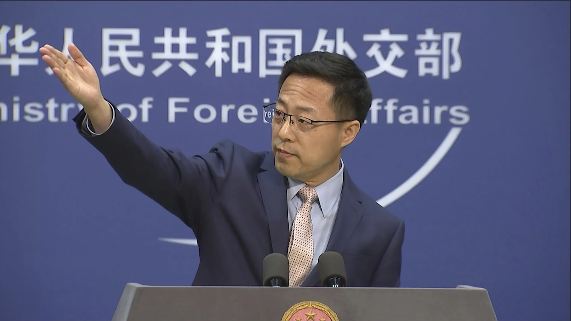 Chinese foreign ministry spokesperson Zhao Lijian gestures during a press briefing in Beijing on Monday, Nov. 23, 2020. China on Monday lashed out at Washington over its withdrawal from the "Open Skies Treaty" with Russia, saying the move undermined military trust and transparency and imperiled future attempts at arms control. (AP Photo/Liu Zheng)