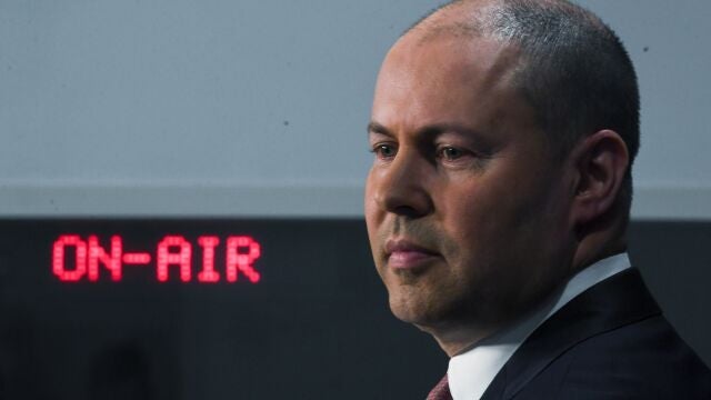 Australian Treasurer Josh Frydenberg speaks to the media during a press conference at Parliament House in Canberra, Tuesday, Dec. 8, 2020. Australiaâ€™s government will reveal legislation in Parliament on Wednesday that would make Facebook and Google pay for journalism. (Lukas Coch/AAP Image via AP)