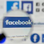FILE PHOTO: Facebook logos are seen on a screen in this picture illustration taken December 2, 2019. REUTERS/Johanna Geron/Illustration/File Photo