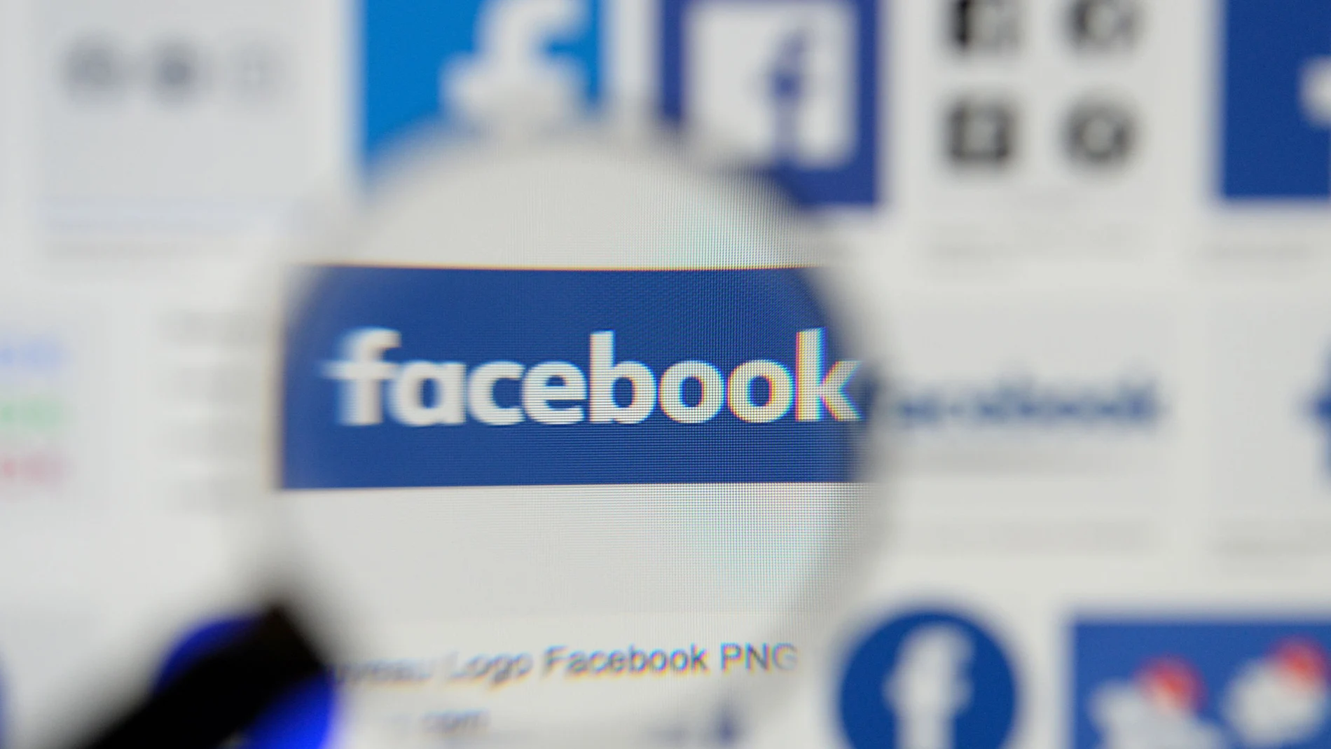 FILE PHOTO: Facebook logos are seen on a screen in this picture illustration taken December 2, 2019. REUTERS/Johanna Geron/Illustration/File Photo