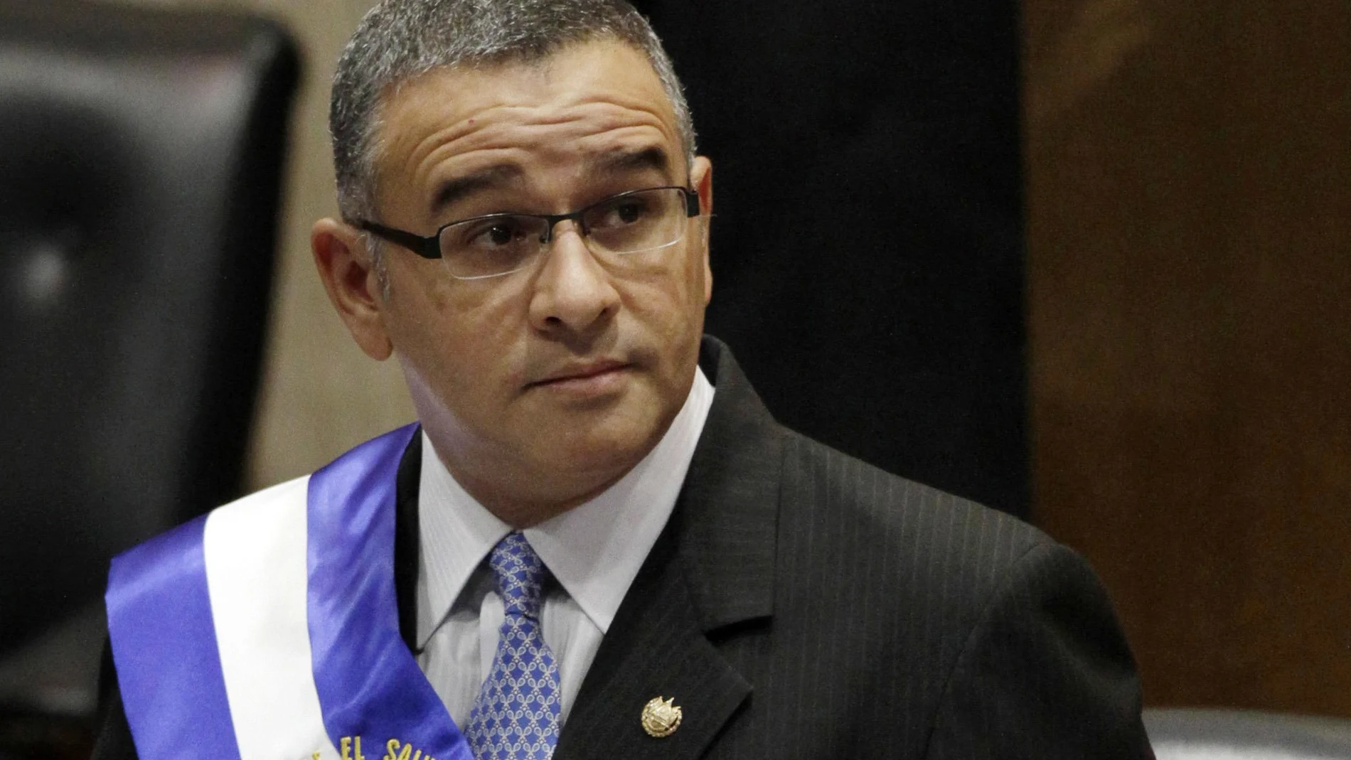 FILE - In this June 1, 2012 file photo, El Salvador's President Mauricio Funes stands in the National Assembly before speaking to commemorate the anniversary of his third year in office in San Salvador, El Salvador. The Salvadoran government announced on Thursday, Dec. 17, 2020, that it has new criminal charges against the ex-president. (AP Photo/Luis Romero, File)