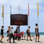 Varias personas en la playa australiana de Manly
