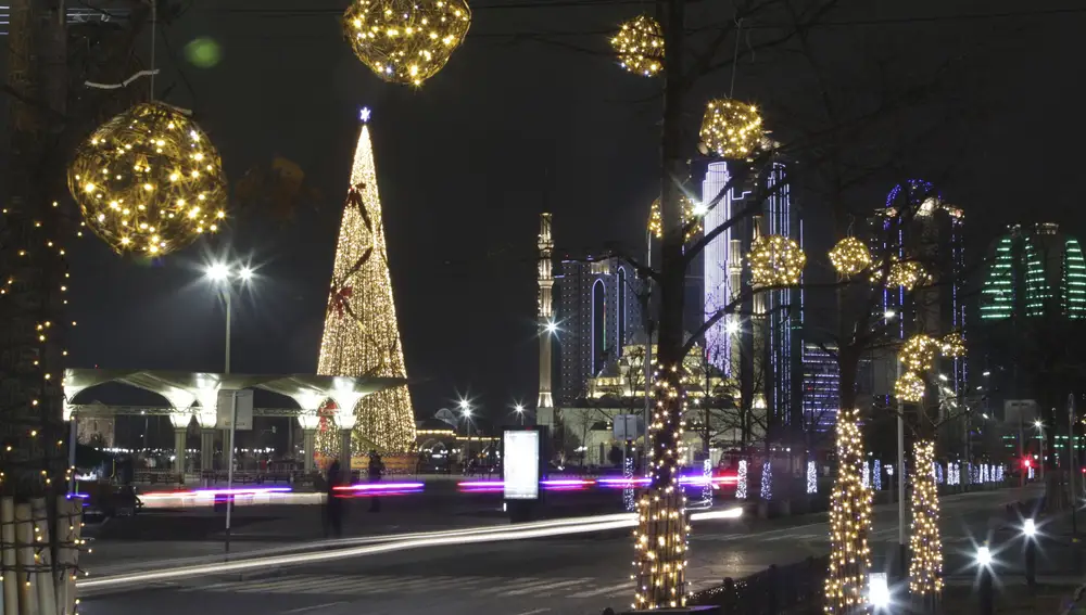 A square decorated for New Year celebrations is seen nearly deserted and without the Holiday Market due to the virus-related restrictions prior to New Year's celebrations in Grozny, Russia, Thursday, Dec. 31, 2020. (AP Photo/Musa Sadulayev)