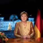 German Chancellor Angela Merkel poses for photographs after the television recording of her annual New Year's speech at the chancellery in Berlin, Germany December 30, 2020. Picture taken December 30, 2020. Markus Schreiber/Pool via REUTERS
