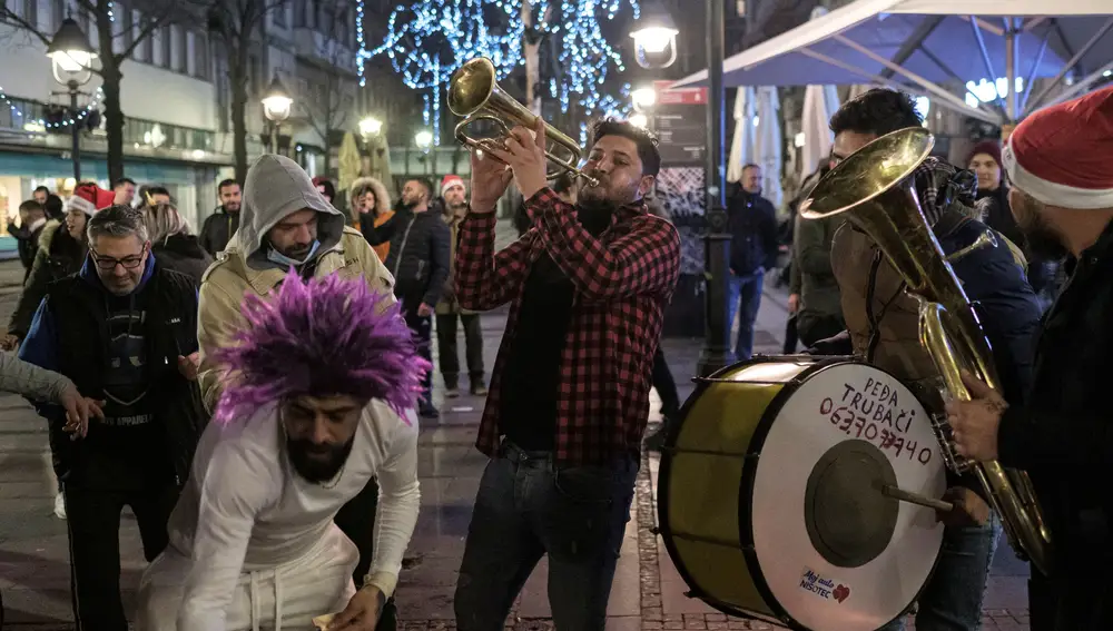 People sing and dance on the streets during the New Year celebrations, amid the coronavirus disease (COVID-19) outbreak in Belgrade, Serbia, January 1, 2021. REUTERS/Marko Djurica