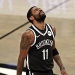 Brooklyn Nets guard Kyrie Irving reacts to missing a shot during the second half of the team's NBA basketball game against the Atlanta Hawks, Friday, Jan. 1, 2021, in New York. (AP Photo/Adam Hunger)