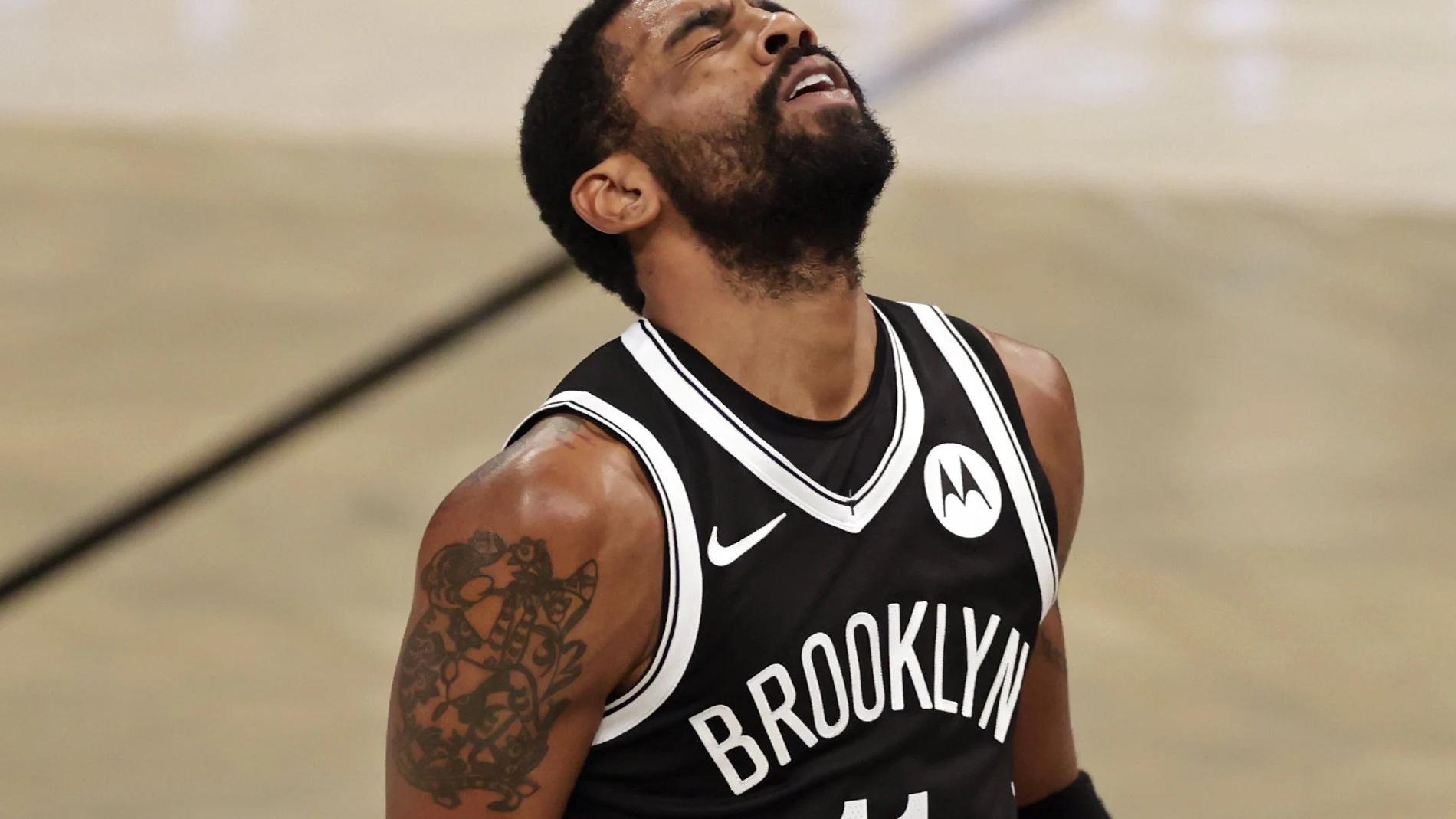 Brooklyn Nets guard Kyrie Irving reacts to missing a shot during the second half of the team's NBA basketball game against the Atlanta Hawks, Friday, Jan. 1, 2021, in New York. (AP Photo/Adam Hunger)