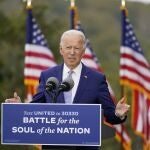 FILE - In this Oct. 27, 2020, file photo, then-Democratic presidential candidate former Vice President Joe Biden speaks at Mountain Top Inn & Resort in Warm Springs, Ga. President-elect Joe Biden has evoked Franklin Delano Roosevelt in promising a remaking of America unseen since the New Deal. Pledging to emulate some of the loftiest reforms in the nationâ€™s history has left him with towering promises to keep. And Biden hopes to deliver against the backdrop of the pandemic and searing national division. (AP Photo/Andrew Harnik, File)