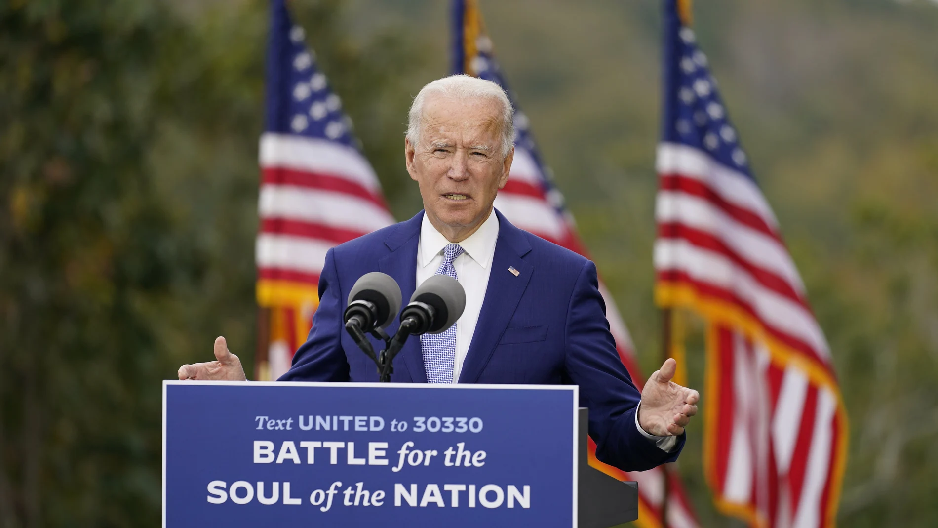 FILE - In this Oct. 27, 2020, file photo, then-Democratic presidential candidate former Vice President Joe Biden speaks at Mountain Top Inn & Resort in Warm Springs, Ga. President-elect Joe Biden has evoked Franklin Delano Roosevelt in promising a remaking of America unseen since the New Deal. Pledging to emulate some of the loftiest reforms in the nation’s history has left him with towering promises to keep. And Biden hopes to deliver against the backdrop of the pandemic and searing national division. (AP Photo/Andrew Harnik, File)
