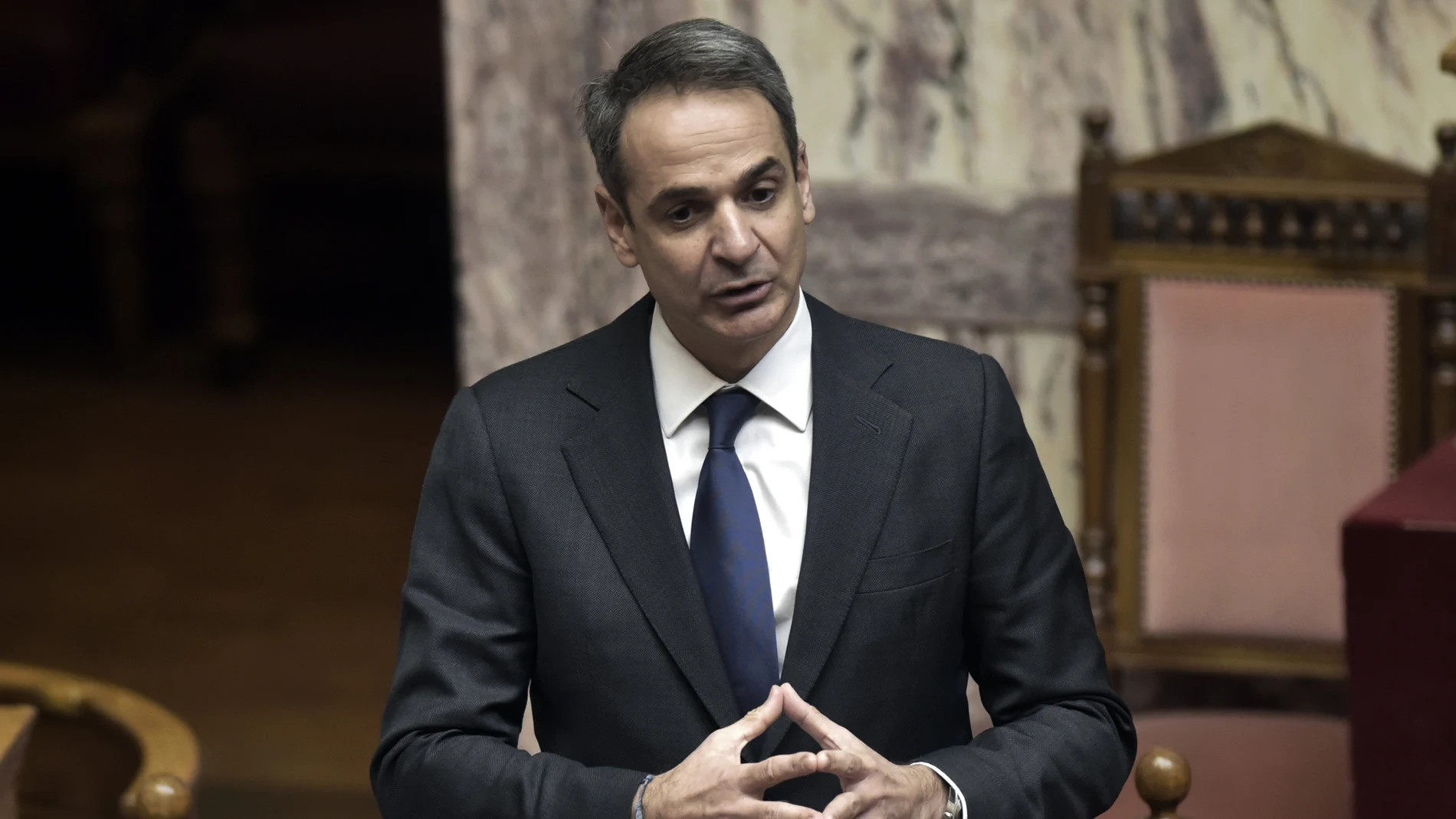 Greece's Prime Minister Kyriakos Mitsotakis speaks during a Parliament debate in Athens, Wednesday, Jan. 20, 2021. Lawmakers in Greece are set to approve legislation to extend the country's territorial waters along its western coastline from six to 12 nautical miles. (Giorgos Zachos/InTime News via AP)