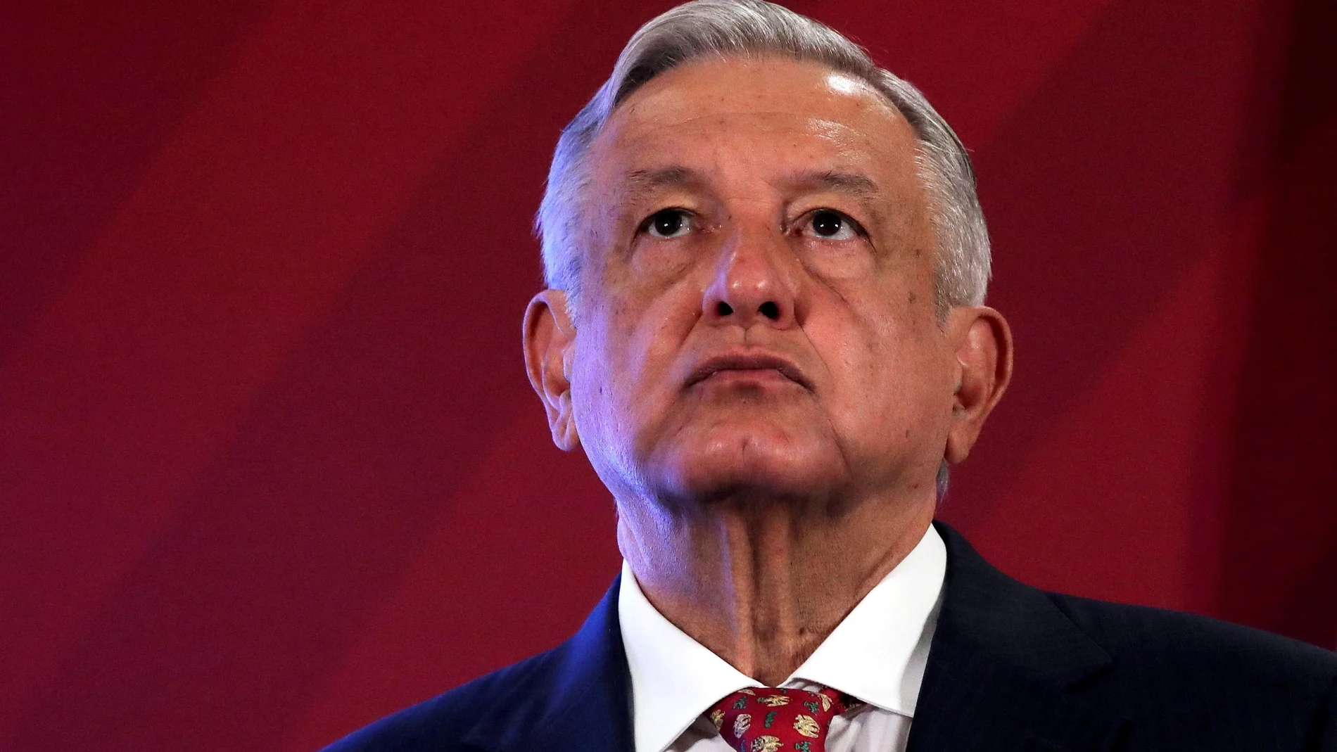 FILE PHOTO: Mexico's President Andres Manuel Lopez Obrador looks up during a news conference at the National Palace in Mexico City, Mexico June 30, 2020. Picture taken June 30, 2020. REUTERS/Henry Romero/File Photo
