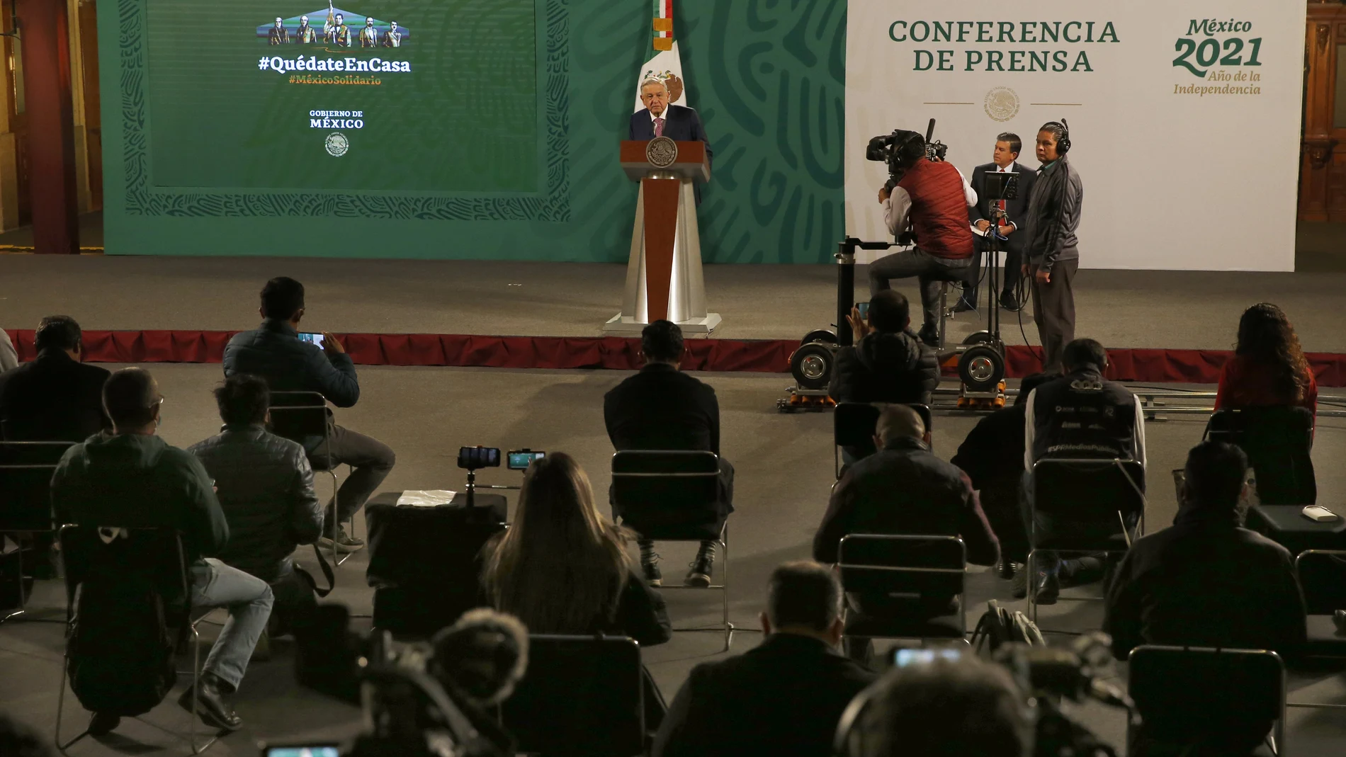 Mexican President Andrés Manuel López Obrador gives his daily morning press conference following a two-week absence after he tested positive for coronavirus, at the presidential palace, Palacio Nacional, in Mexico City, Monday, Feb. 8, 2021. (AP Photo/Marco Ugarte)