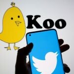 FILE PHOTO: Twitter logo is seen on smartphone in front of displayed Koo app logo in this illustration taken, February 10, 2021. REUTERS/Dado Ruvic/Illustration/File Photo
