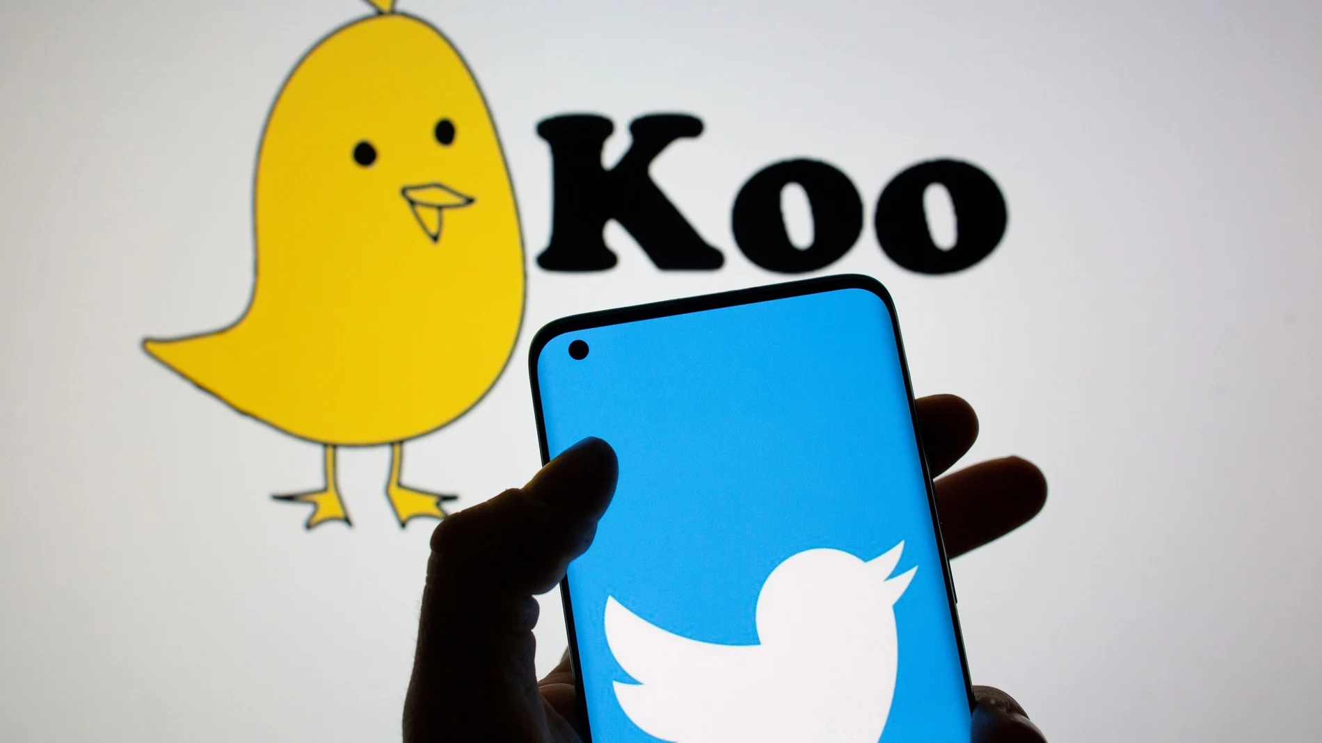 FILE PHOTO: Twitter logo is seen on smartphone in front of displayed Koo app logo in this illustration taken, February 10, 2021. REUTERS/Dado Ruvic/Illustration/File Photo