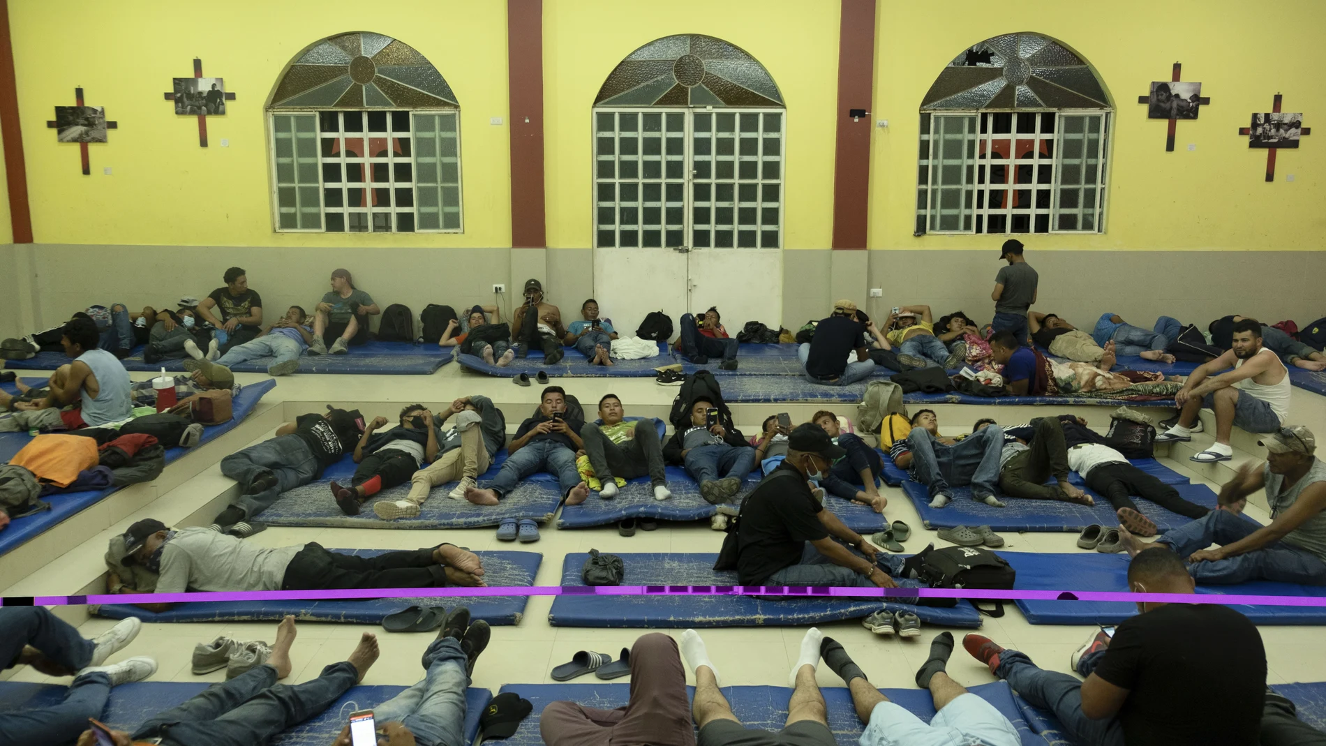 Central American migrants rest at the La 72 shelter in Tenosique, Tabasco state, Mexico, Tuesday, Feb. 9, 2021. When Guatemalan authorities blocked a migrant caravan last month drawing international attention the flow of migrants might have seemed to slow down, but a growing number of small groups continue to flow daily from Central America into Mexico. (AP Photo/Isabel Mateos)