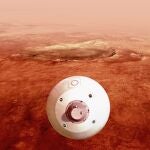 Fotografía cedida por la Administración Nacional de Aeronáutica y el Espacio (NASA) donde aparece una ilustración del "aeroshell" que contiene el rover Perseverance mientras gira en preparación para un aterrizaje seguro sobre la superficie de Marte.