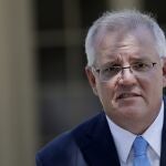 Australia's Prime Minister Scott Morrison speaks to the media in Sydney, Monday, March 1, 2021. Morrison stood by an unnamed Cabinet minister against calls for him to step down from office over an allegation that he raped a 16-year-old girl more than 30 years ago. (AP Photo/Rick Rycroft)
