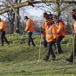A search team near Eagle Pond on Clapham Common Sunday March 7, 2021, search for traces connected to missing 33-year old woman Sarah Everard, who has been missing since Wednesday. Everard left a friend's house in Clapham, south London, on Wednesday evening to walk home has not been seen or heard from since. (Jonathan Brady/PA via AP)