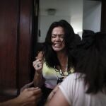 Mailin Gobbo reacts as she leaves the courtroom after hearing a judge acquit former Catholic Priest Carlos Eduardo Jose, who she says sexually abused her for years when she was an adolescent, in San Martin, Argentina, Tuesday, March 9, 2021. The court acquitted the 62-year-old, citing the statute of limitations had run out. (AP Photo/Natacha Pisarenko)