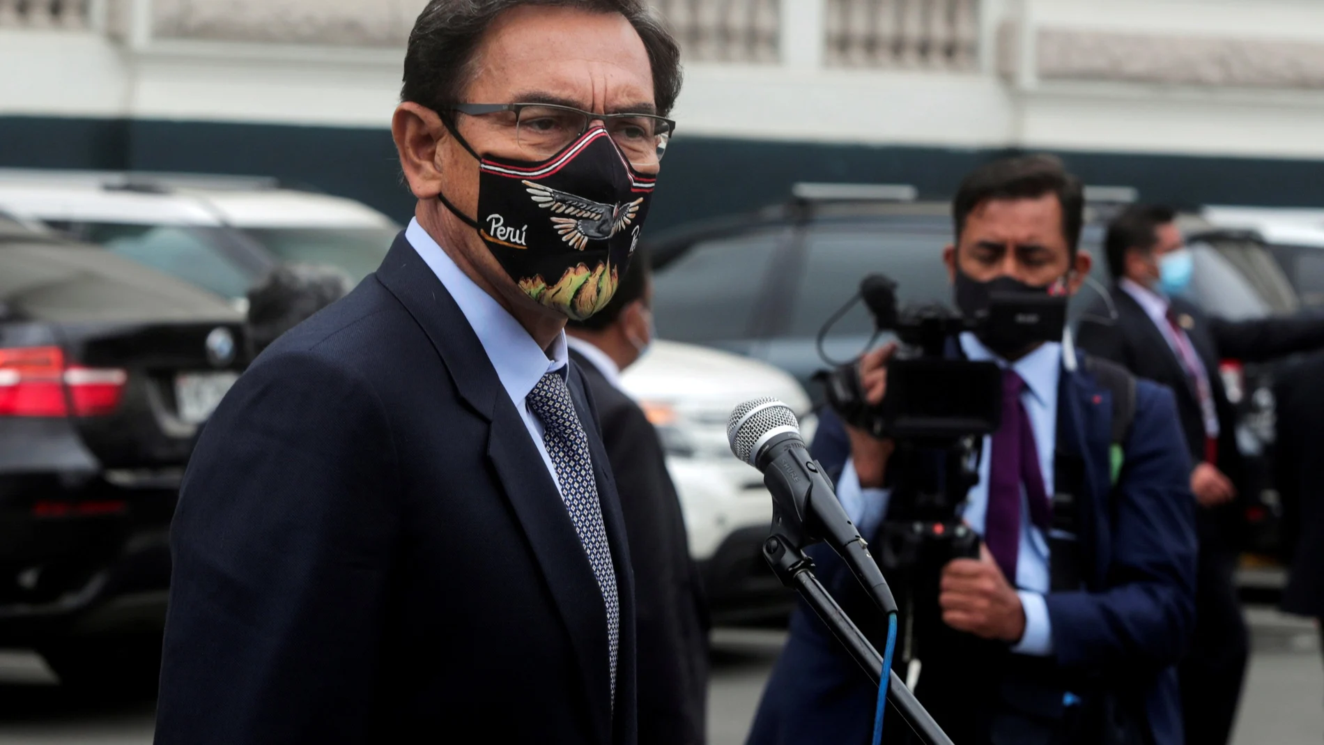 FILE PHOTO: Peru's President Martin Vizcarra addresses the media outside Congress as he faces a second impeachment trial over corruption allegations, in Lima, Peru November 9, 2020. REUTERS/Sebastian Castaneda/File Photo