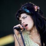 FILE PHOTO: British singer Amy Winehouse performs during the "Rock in Rio" music festival in Arganda del Rey, near Madrid, July 4, 2008. REUTERS/Juan Medina/File Photo