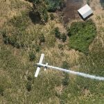 FILE - In this June 4, 2008 file photo, counter-narcotic police spray herbicides over coca fields in El Tarra, in the Catatumbo river area, near Colombia's northeastern border with Venezuela. The South American countryâ€™s environmental authority said on Thursday, April 15, 2021, that it does not oppose the government's use of glyphosate in its future coca eradication plan. The move is seen as a prerequisite to restarting crop-dusting of coca plantations with the herbicide. (AP Photo/Luis Robayo, File)
