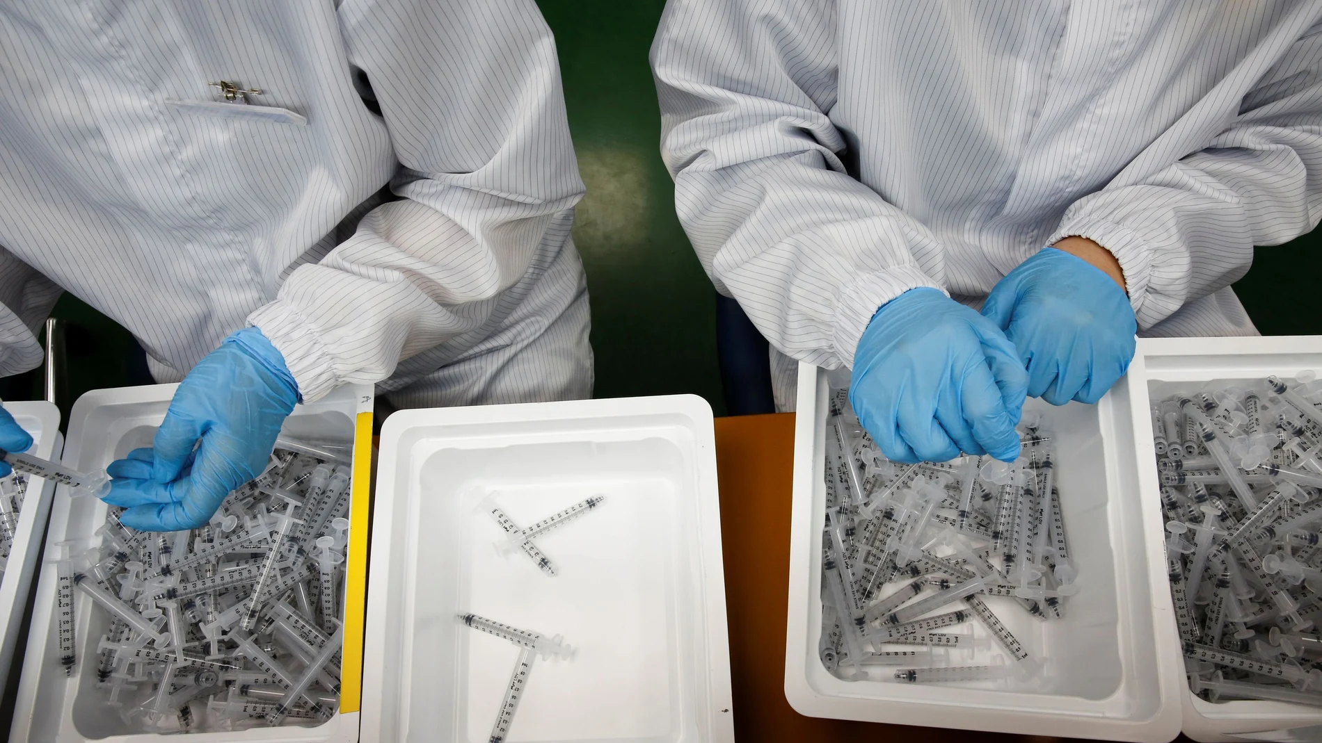 Employees work at a low dead space (LDS) syringe factory in Gunsan, South Korea, April 5, 2021. Picture taken April 5, 2021. REUTERS/Heo Ran