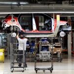 Workers assemble vehicles on the assembly line of the SEAT car factory in Martorell, near Barcelona, Spain.