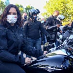 La presidenta de la Comunidad de Madrid y candidata a la reelección, Isabel Díaz Ayuso, en una moto durante un encuentro con representantes de asociaciones de Fuerzas y Cuerpos de Seguridad del Estado