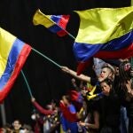 12 May 2021, Colombia, Bogota: Demonstrators wave Colombian flags during a protest against the government of Colombian President Ivan Duque Marquez. Photo: Sergio Acero/colprensa/dpa12/05/2021 ONLY FOR USE IN SPAIN