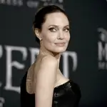 FILE - In this Sept. 30, 2019, file photo, Angelina Jolie arrives at a premiere at the El Capitan Theatre in Los Angeles. Jolie criticized a judge deciding on custody arrangements for her and Brad Pitt's children during their divorce, saying in a court filing on Monday, May 24, 2021, that the judge refused to allow their kids to testify. (Photo by Richard Shotwell/Invision/AP)