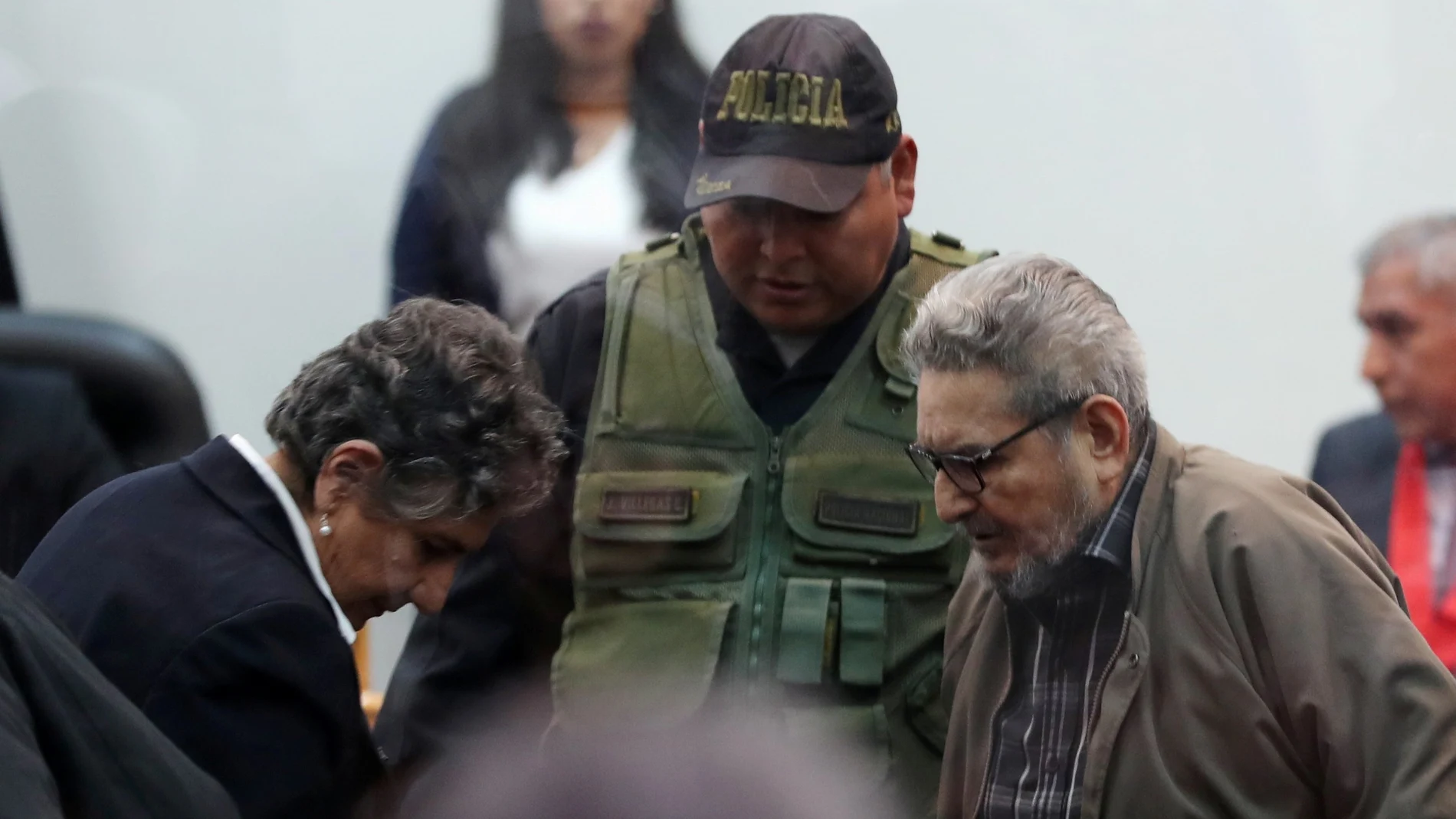 FILE PHOTO: Shining Path founder Abimael Guzman and his wife and second leader Elena Iparraguirre attend a trial during sentence of a 1992 Shining Path car bomb case in Miraflores, at a high security naval prison in Callao, Peru September 11, 2018. Picture taken through a window. REUTERS/Mariana Bazo/File Photo