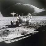 FILE - In this 1971 photo made available by NASA, astronaut James Irwin stands next to a rover on the surface of the moon. On Wednesday, May 26, 2021, Lockheed Martin and General Motors announced that they would combine their technological and manufacturing expertise to build the electric vehicles for NASAâ€™s Artemis program, named after the twin sister of Apollo in Greek mythology. (NASA via AP, File)